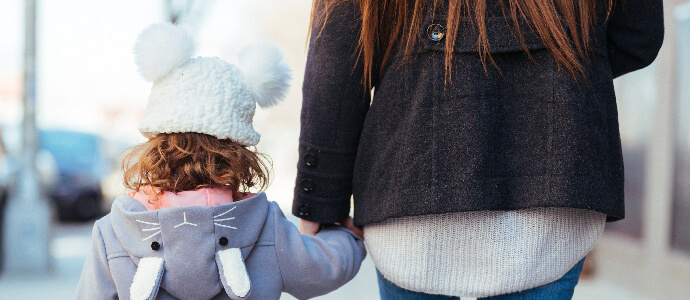 Mother and Daughter Walking together holding hands, child custody