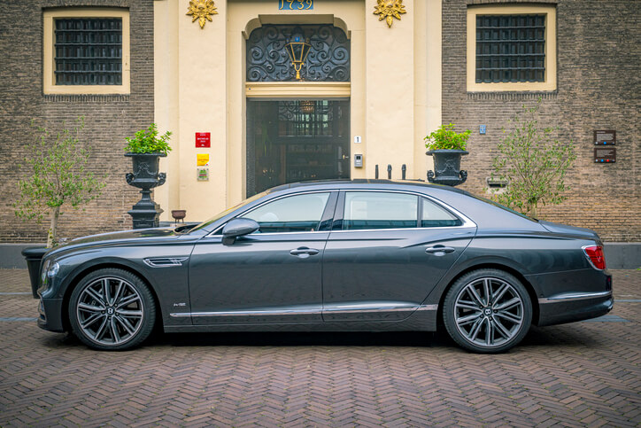 Bentley Flying Spur parked on the side of the road.