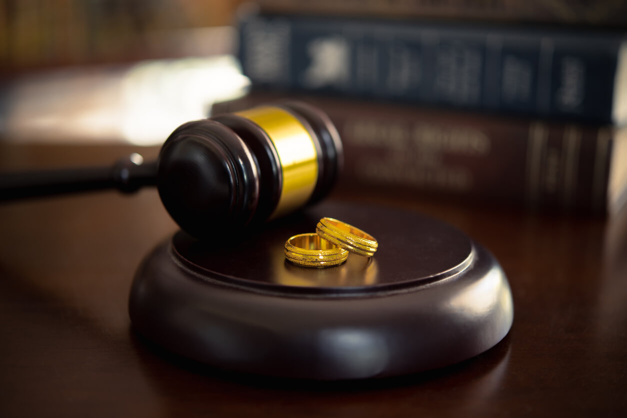 Divorce law, family law concepts. Court gavel ,ring and law book at lawyer office. dissolve a marriage.