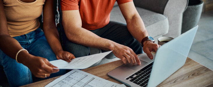 Couple at computer with finances
