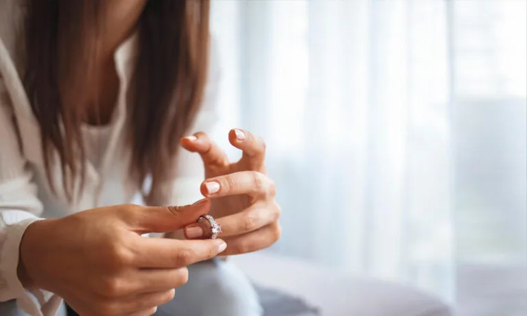 Woman taking her ring off