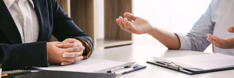 Woman sitting with divorce attorney