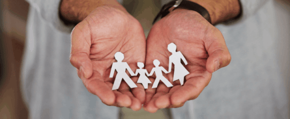 family cutout in hands