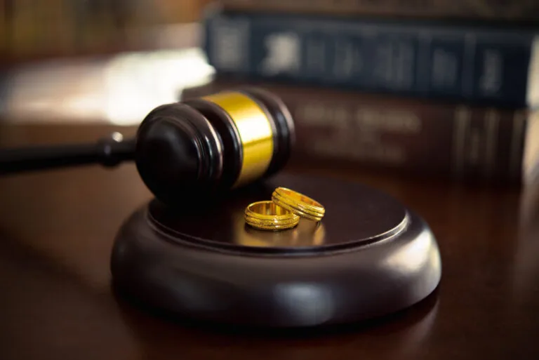 Divorce law, family law concepts. Court gavel ,ring and law book at lawyer office. dissolve a marriage.