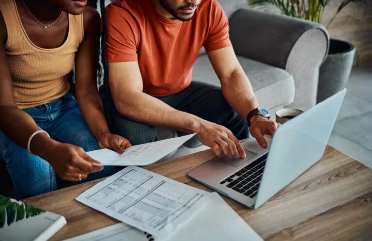 Couple at computer with finances